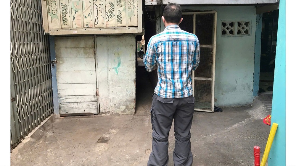 A local guide with guests in a Saigon neighbourhood
